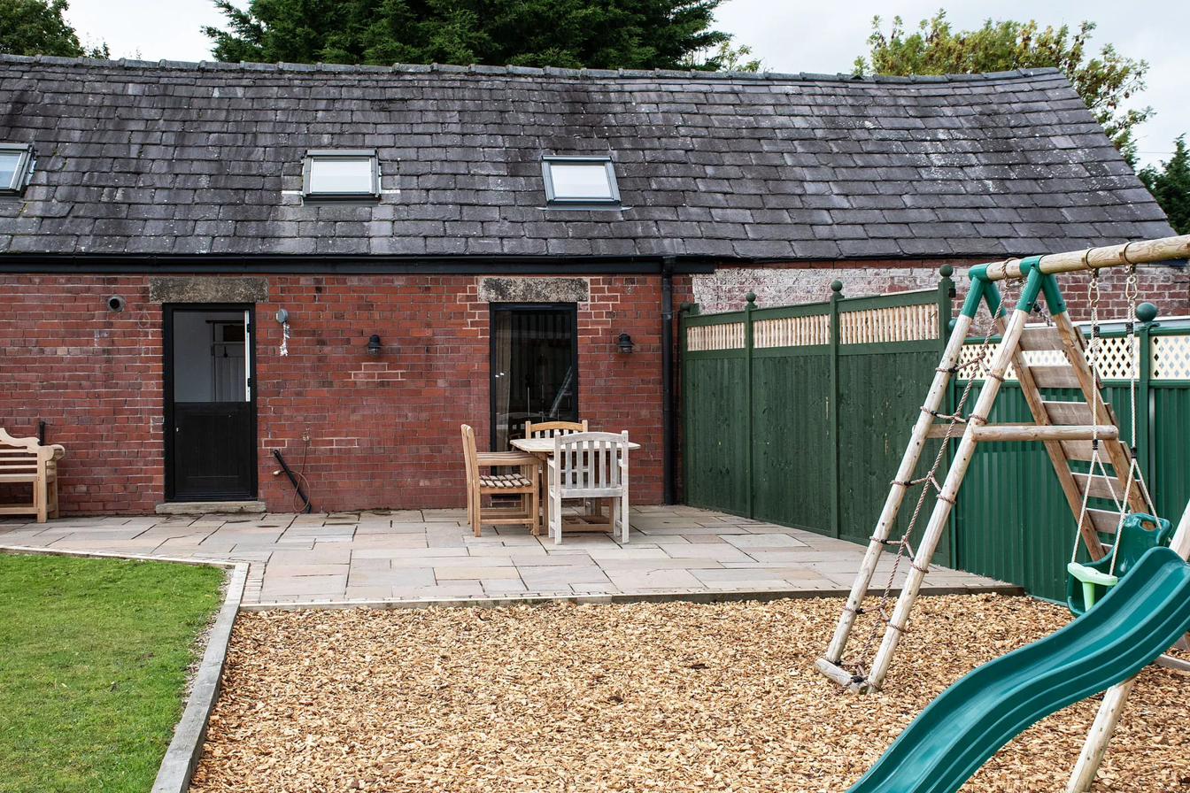 Farmhouse garden with outdoor play space