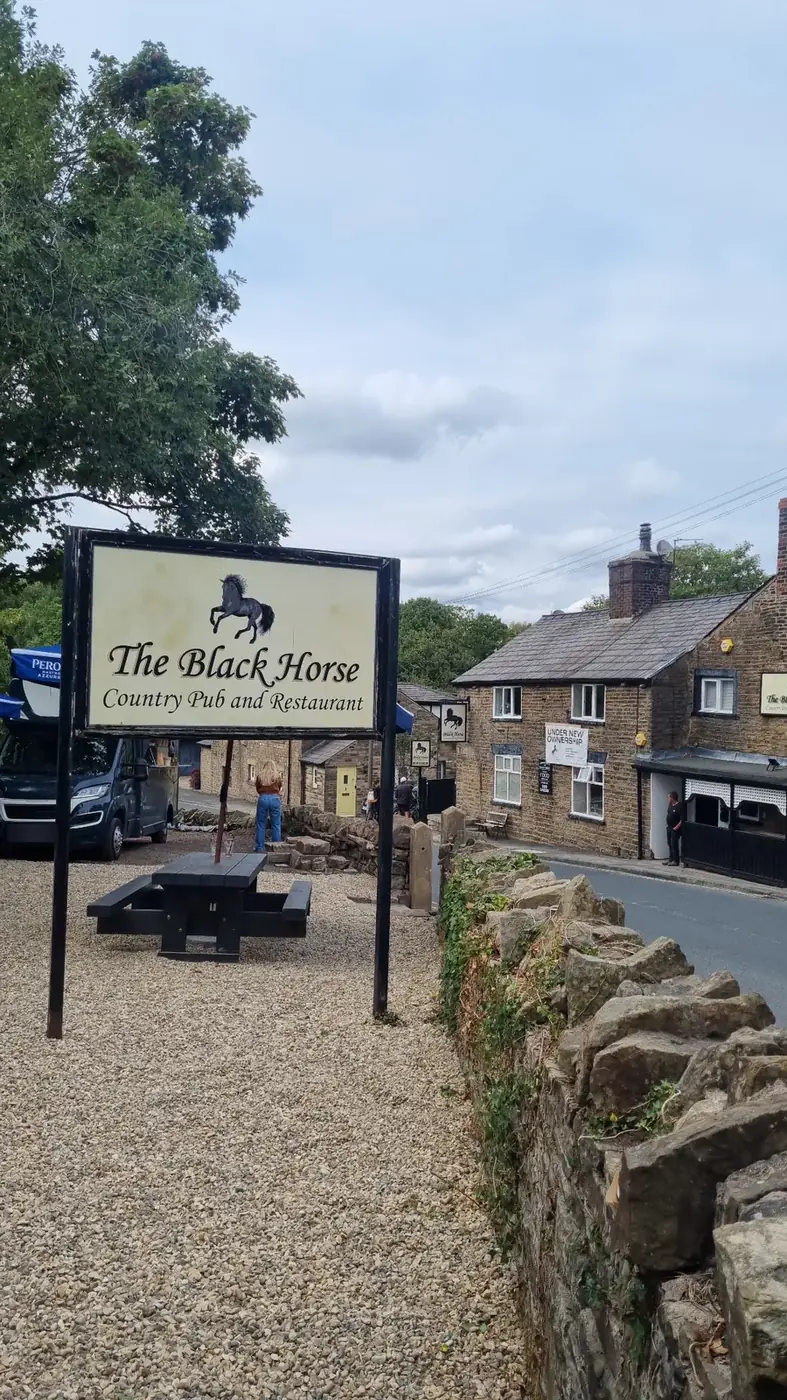 The Black Horse sign and pub in Limbrick