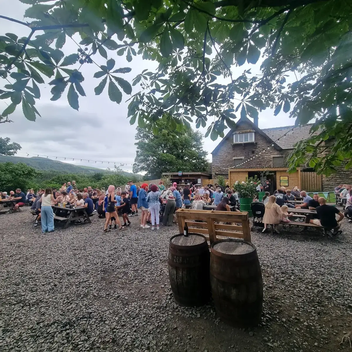 Busy outdoor seating at a brewery taproom near Rivington